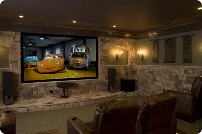 Dedicated home theater room with projector and seating