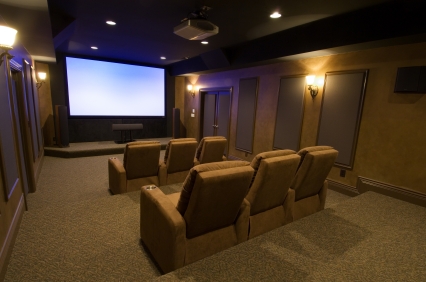 Tiered theater seating and projection screen